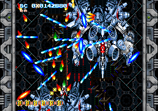 A boss fight in the bonus stage, crowded with large silver ships and blue bullets