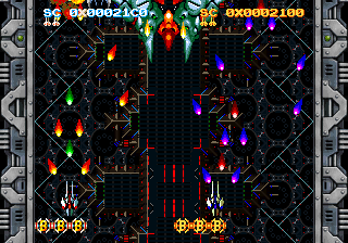 Two ships firing in stage 1, player 1's score top left in white, player 2's top right in gold, between the metal side strips